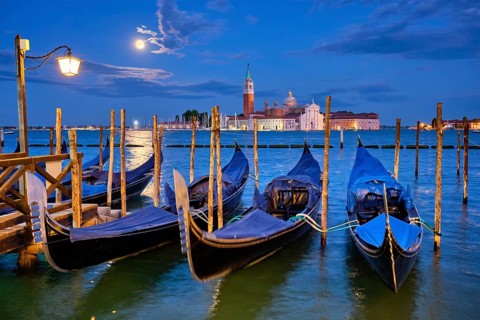 Romantic vacation Venice travel background, gondolas at Saint Mark (San Marco) square and Basilica