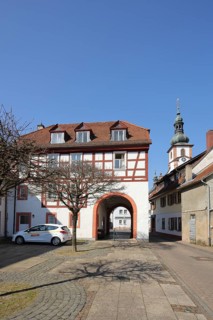Historic Schleifrashaus, Schleifrashof and church tower, half-timbered house, Salmünster, Bad