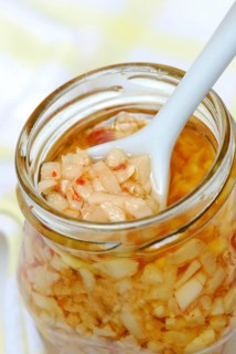 Aglio e Olio, pasta sauce from garlic, olive oil, and peperoncino in glass, chillies, Mediterranean