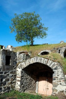 Chateaugay. Wine cellars carved out of the rock. Puy de Dome department. Auvergne Rhone Alpes.