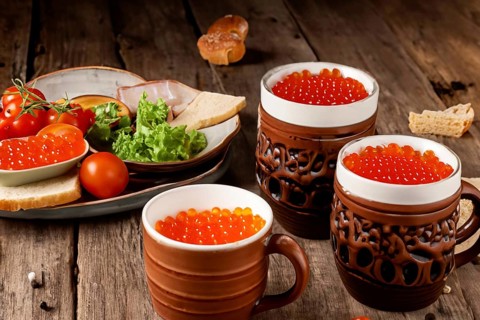 Different kinds of caviar with bread and beverages, AI generated