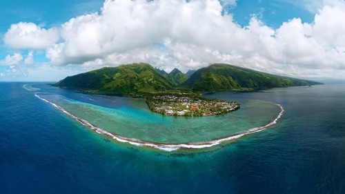 Aerial view, panorama, fringing reef in front, beach village Taurita behind, Tai'arapu-Est