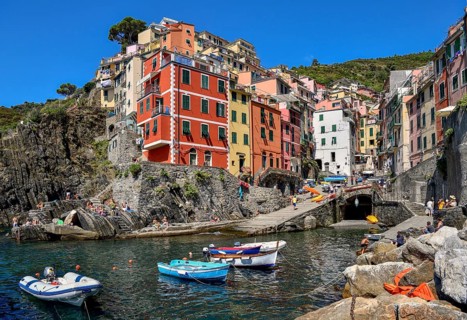 Fishing boats in the harbour of Riomaggiore, village view, Cinque Terre, province of La Spezia,