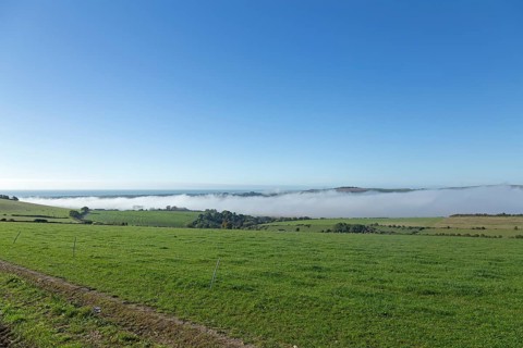 High fog over valley of River Adur, Shoreham by Sea, South Downs, West Sussex, England, United
