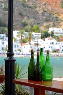 Empty green bottles as decoration, view of Loutro, South Crete, Crete, Greece, Europe