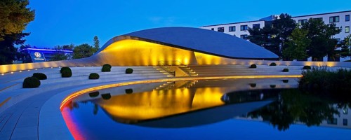 Illuminated Porsche Pavilion in the evening, Autostadt, Volkswagen AG, Wolfsburg, Lower Saxony,
