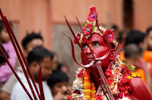 GUWAHATI, INDIA, AUGUST 19: Priest dance in the beat of Dhol (Drum) during the annual