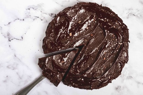 Chocolate cake, round cake, on a marble light table, top view, homemade cakes, no people