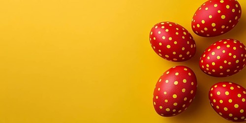 Red Easter eggs with golden dots on yellow background with copy space. Generative AI, AI generated