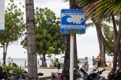 Tsunami Hazard Zone. Warning sign, signposting of escape routes in the event of another seaquake.
