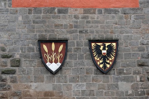 Spelt and imperial eagle in the coat of arms at the Wörnitz Gate, Dinkelsbühl, Bavaria, Germany,