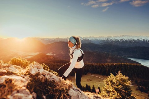 Trail running in autumn on the Jochberg on Lake Walchensee against the wonderful backdrop of the