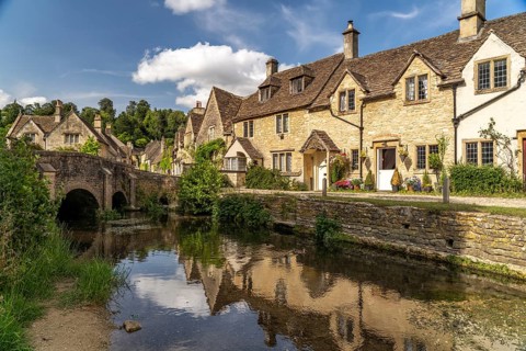 The village of Castle Combe on the River Bybrook, Cotswolds, Wiltshire, England, Great Britain