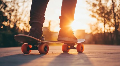Skateboarder on a skateboard on the city streets at sunset., AI generated