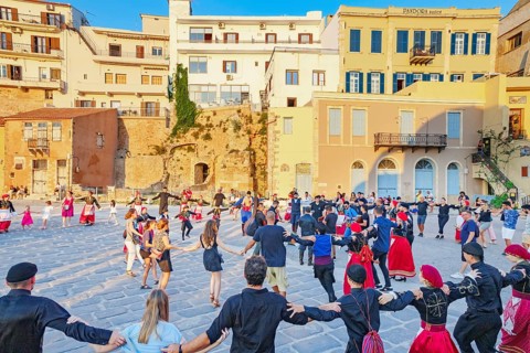 Group of people performing traditional Greek dance, Chania, Crete, Greek Islands, Greece, Europe