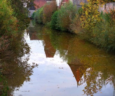 Reflection of the medieval defence wall in the Wörnitz, Dinkelsbühl, Bavaria, Germany, Europe
