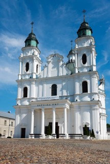 Historic baroque church with twin towers, under a clear sky, Basilica of the Nativity of the Virgin