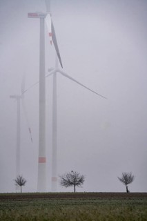 Wind farm in fog, dark doldrums, no wind no direct sunlight, in the Rhenish lignite mining area,