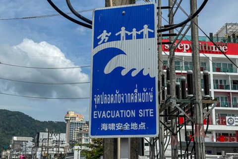 Tsunami Hazard Zone. Warning sign, signposting of escape routes in the event of another seaquake.