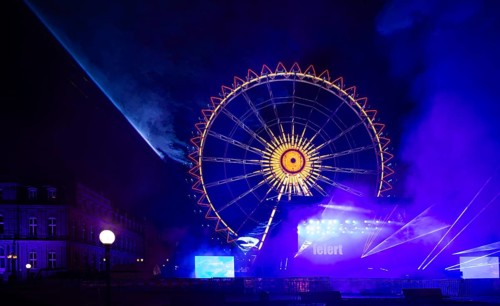 Night shot, rehearsal for New Year's Eve party, theatre, laser show, light show, Ferris wheel,
