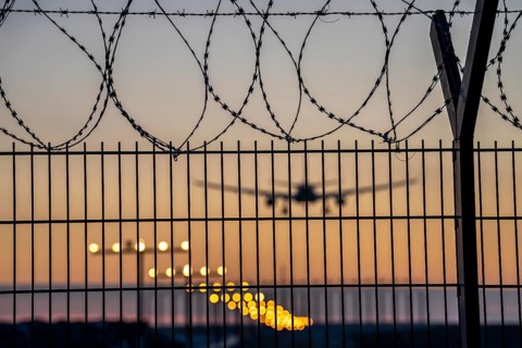 Symbolic image security at the airport, outer fence at Düsseldorf International Airport, steel wire