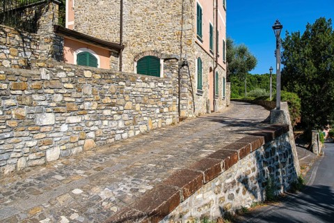 La Casa del Priore, a historic building and restaurant on the castle hill of Andora, province of