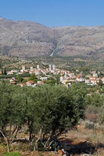 Flomochori fortified village on the Mani, olive groves in front, Laconia, Peloponnese, Greece,