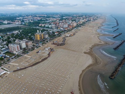 Bathing beach in Rimini. Bathing beach on the Adriatic in bad weather. All deckchairs are free.