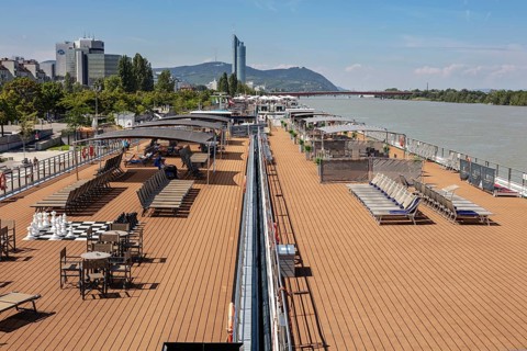 Lounge deck on the riverbank with a view of the city, Vienna