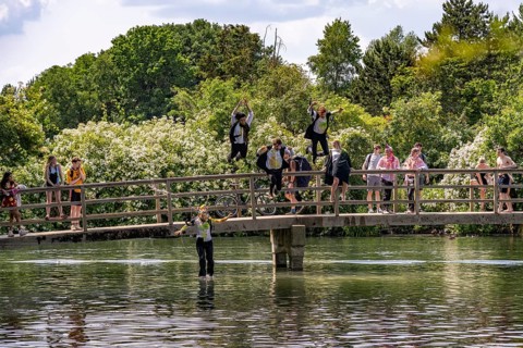 Oxford students jumping into the Thames at Port Meadow in Oxford, Oxfordshire, England, United