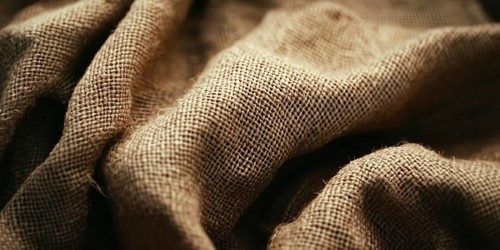 Banner with brown natural cotton linen fabric with rough texture. Generative AI, AI generated