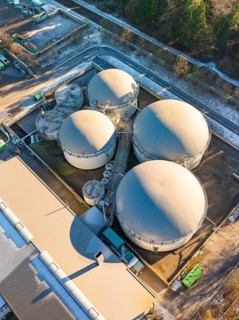 Aerial view of large industrial tank facilities in a snowy environment, Neubulach, Black Forest,
