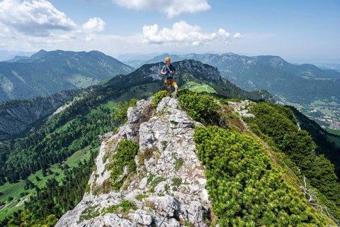 Climber on a climbing tour, climber on a mountain ridge, alpine climbing, crossing the Kampenwand,