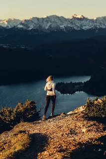Trail running in autumn on the Jochberg on Lake Walchensee against the wonderful backdrop of the