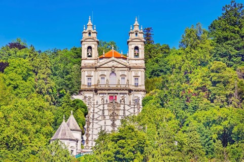View of Bom Jesus do Monte santuary immersed in the greenery of the surrounding woods, Braga, Minho