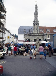 People shopping at the street market, Market Place, Shepton Mallet, Somerset, England, UK 1970s