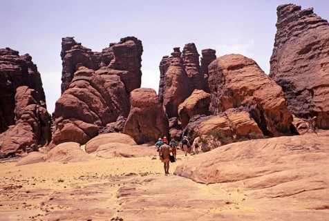 Tourists on their way to cave dwellings, Tassili N'Ajjer National Park, Algeria, North Africa 1973,