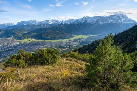 View of Garmisch-Partenkirchen and mountain panorama with Wetterstein mountains, hike to
