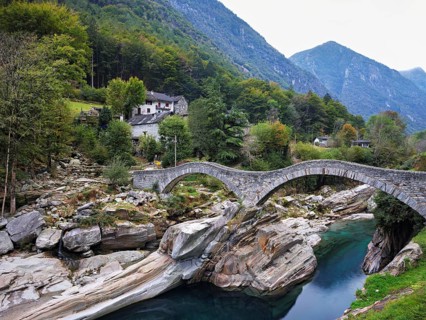 Historic Ponte dei Salti with double arches, Roman bridge, over the Verzasca river, Verzasca