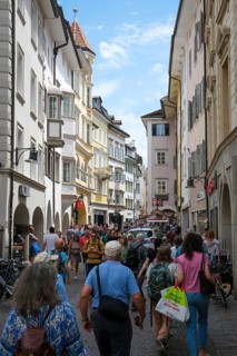 Bolzano, South Tyrol, Italy, Passers-by stroll through the Laubengasse in the old town centre,