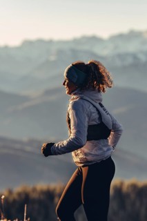 Trail running in autumn on the Jochberg on Lake Walchensee against the wonderful backdrop of the