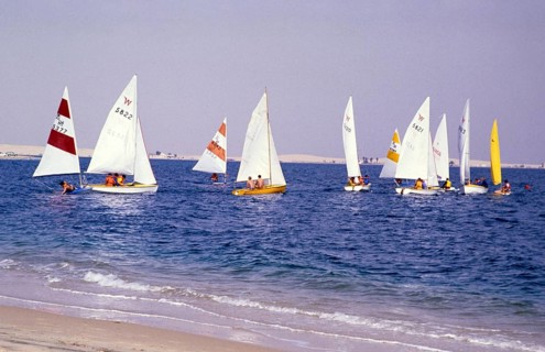 Leisure activities of foreign workers sailing on Wayfarer dinghies, Half Moon Bay, Saudi Arabia