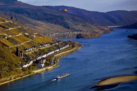 Elevated view of the Rhine and Lorch from Bacharach with barge and helicopter, Upper Middle Rhine