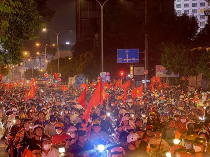 Football fans celebrate in the streets, victory in Asean championship against Thailand, many