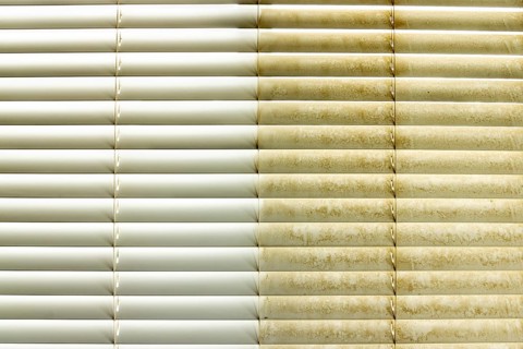 Residential window shades showing the before and after of a good cleaning, one side clean and one
