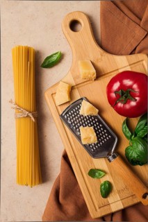 Raw pasta with ingredients on a beige background, top view, rustic style, selective focus, no