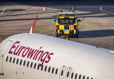 Follow Me vehicle, pilot vehicle, apron supervisor, marshaller, directs an aircraft to its parking