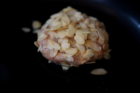 Swabian cuisine, meatballs wrapped in almonds, mixed minced meat, raw, frying meatballs in fat,