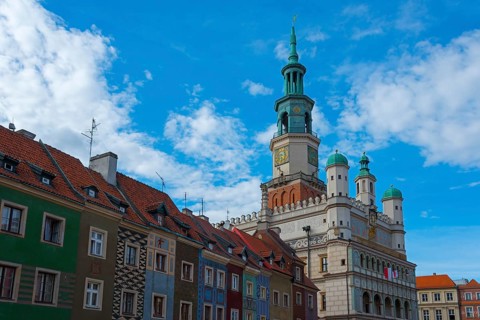 Town Hall surrounded by colourful houses under a sunny sky, Town Hall, Market Square, Poznan,