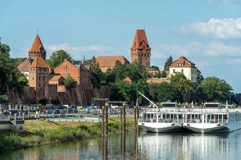 City view with cruise ships on the river Tangier City wall and castle in Tangermünde,